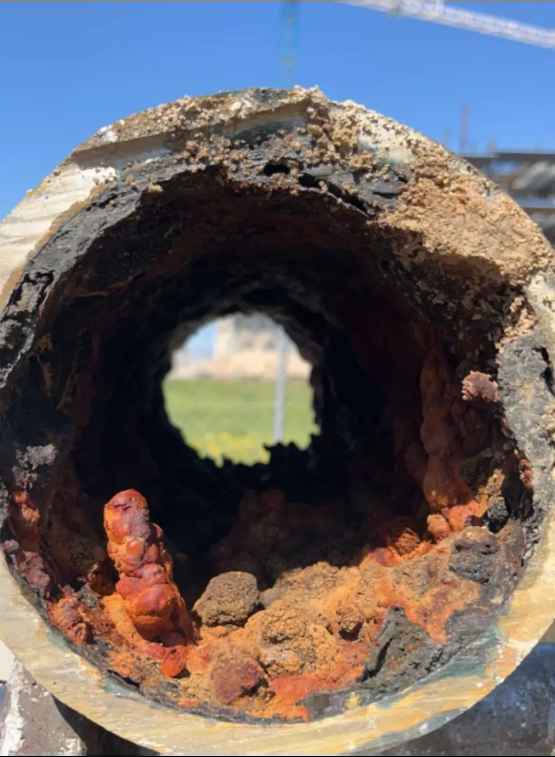 Corrosion and deposits inside a pipe, shown as a general illustration