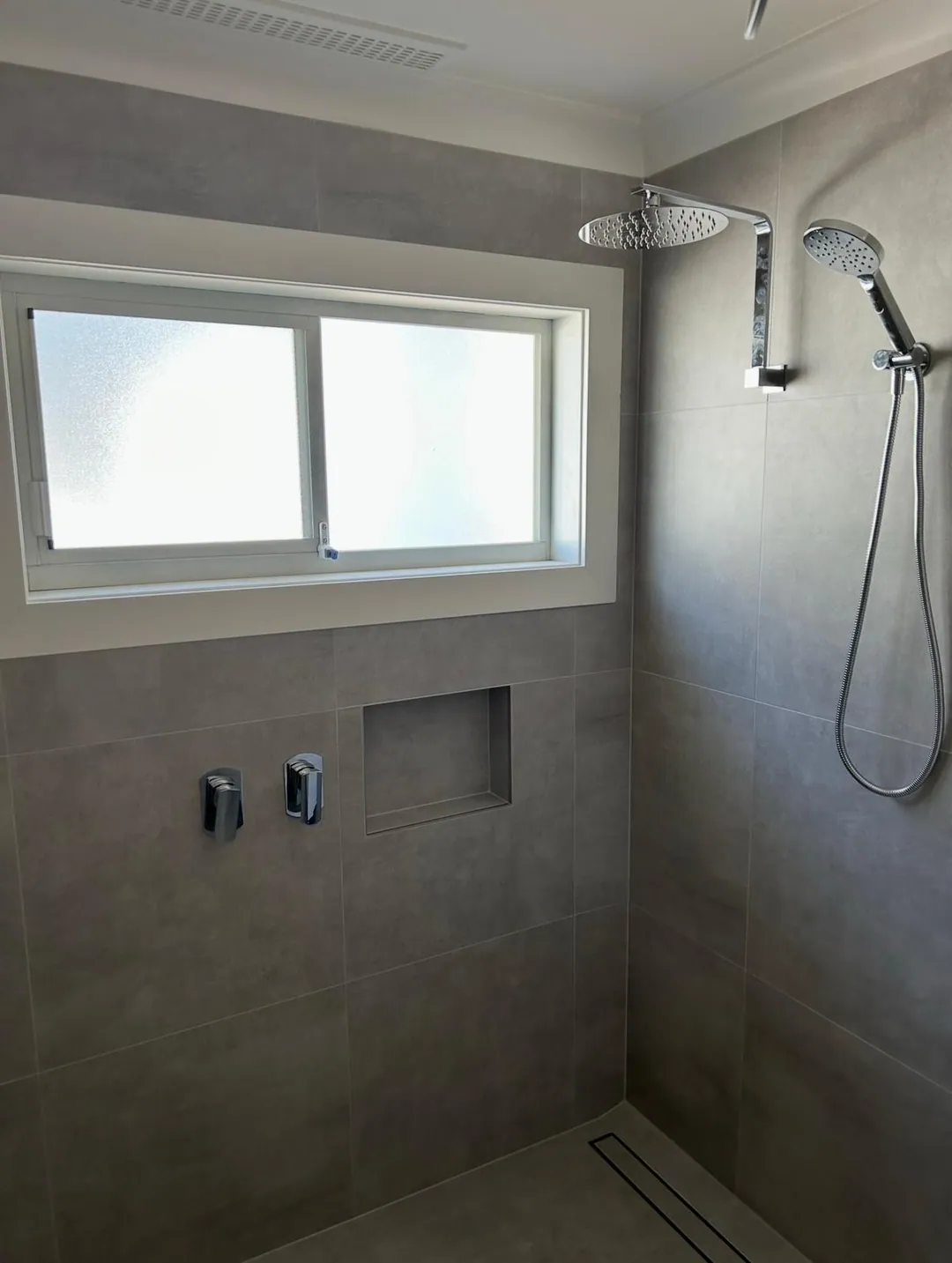 Completed bathroom shower plumbing in a Newcastle renovation