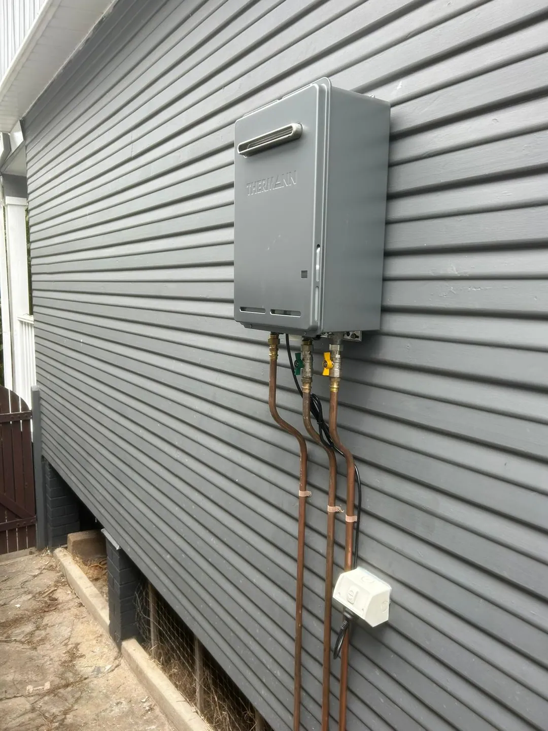 Gas hot water unit installed by a licensed gas fitter