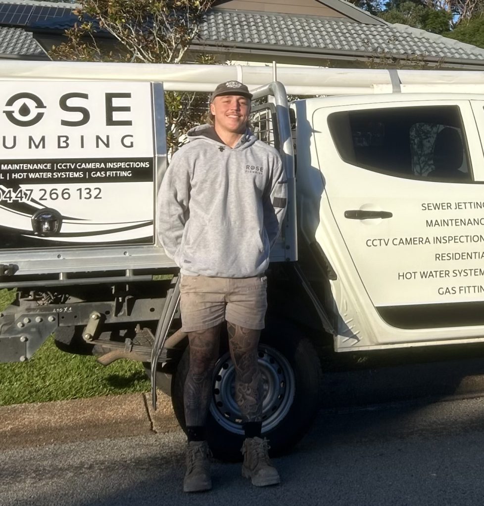 A photo of Lleyton and his sign written ute - Our plumber Newcastle locals Trusts